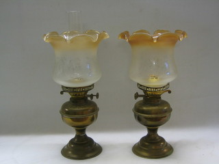 2 brass oil lamps with glass shades