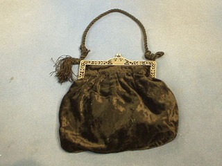 A lady's black evening bag with pierced silver mounts