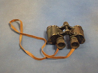 A pair of WWII military binoculars by Bausch & Lomb Optical, marked military stereo 6 x 30 complete with leather case