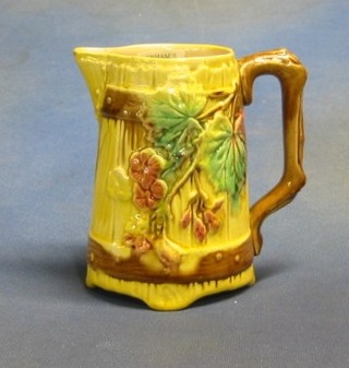 A 19th Century Majolica jug with leaf decoration, 6" (slight crack to spout)