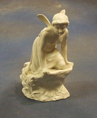 A Parian figure of a crouching fairy (wings f and r) 7"