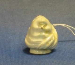 A blanc de chine porcelain pipe head in the form of a Turk's head