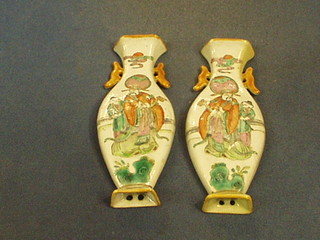 A pair of famille rose porcelain wall pockets in the form of twin handled vases decorated sages 6 1/2"