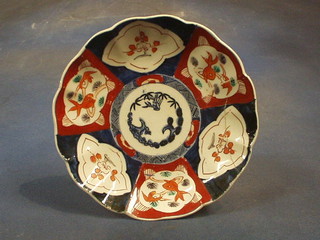 A 19th Century circular Japanese Imari porcelain plate, the centre decorated a leaf with lobed panels 8 1/2" (f and r)