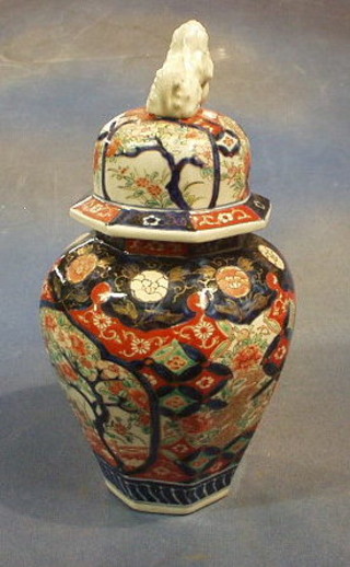 A Japanese Imari octagonal urn and cover, the lid decorated a Dog of Fo 13"