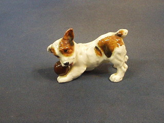 A Royal Doulton figure of a reclining puppy and ball, base marked Royal Doulton HN1103