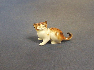 A Royal Doulton figure of a seated cat, the base marked 2584