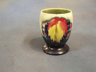 A Moorcroft leaf and grape pattern goblet shaped vase, the base with signature mark, impressed Made in England Pottery to HM The Queen, 4"