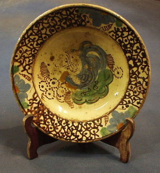 A 19th Century Continental circular terracotta bowl, painted a bird 8" 15-25