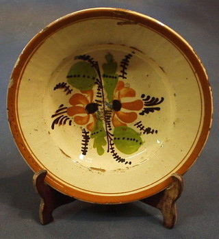 A circular Continental Earthenware pottery bowl with floral decoration 9"