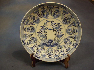 A 19th Century Oriental blue and white porcelain plate with floral decoration, the reverse with 4 character mark 10"