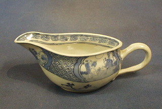 An Oriental porcelain sauce boat decorated court figures, the base with leaf mark 6" (handle cracked)