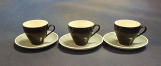 3 Susie Cooper black glazed coffee cups  with turquoise and polka dot saucers (1 f)