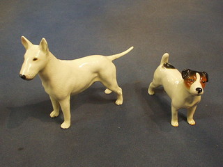 A Beswick white glazed Staffordshire figure of a Pitbull Terrier, 4" (ear and tail f and r) and a figure of a Jack Russell