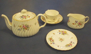 A 23 piece Mintons Marlow tea service comprising teapot, twin handled bread plate, 6 plates, 6 cups and saucers, cream jug, sugar bowl and slop bowl