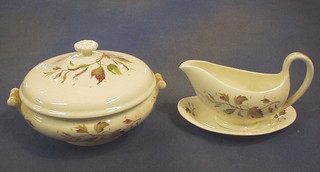 A 30 piece Wedgwood Wakefield pattern dinner service comprising 2 oval pottery meat plates, 6 dinner plates, 6 side plates, 6 soup bowls, 6 tea plates, sauce boat and stand, 2 tureens and covers