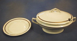 A 29 piece Bavarian white porcelain dinner service with blue and gilt banding comprising 2 tureens and covers, 14 dinner plates (1 chipped), 10 side plates (1 chipped), 3 soup bowls (1 chipped)  and a pottery twin handled lamp