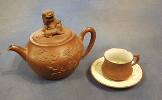 A 9 piece Tanware tea service with teapot the finial in the form of 2 Dogs of Fo and 4 cups and saucers