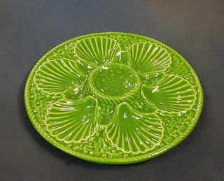 A set of 6 circular green glazed oyster plates 9"