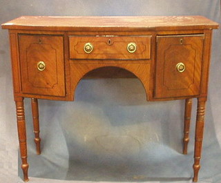 A Georgian mahogany bow front sideboard with inlaid ebonised stringing, fitted 1 long drawer flanked by a pair of deep drawers, raised on ring turned supports 42"