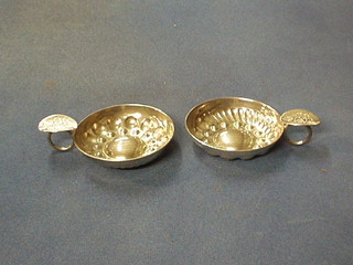 A pair of silver plated wine tasters