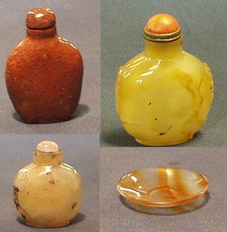 A 19th Century Oriental grey glass snuff bottle 3", an Oriental hardstone snuff bottle and stopper 3" and a circular Oriental veined glass/hardstone saucer 2"