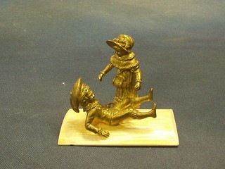 A fine quality 19th Century gilt bronze and ivory figure of 2 children sliding on ice, 4"