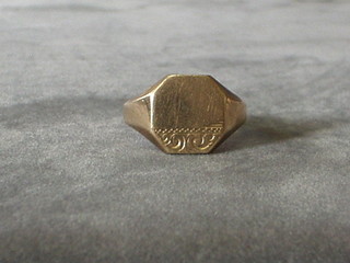 An engraved 9ct gold signet ring