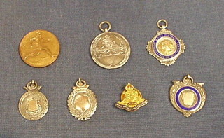 4 silver and enamelled sports watch chain medallions, a  silver Royal Artillery Tug of War medal, a Royal Artillery Association lapel badge and a bronze Athletics medal