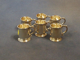 A set of 6 silver spirit measures in the form of tankards, Birmingham 1934