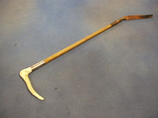 A riding crop with stag horn handle by Zair, with silver mount