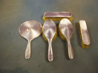 An Art Deco 5 piece purple enamel and silver dressing table set comprising hand mirror, pair of hair brushes and pair of clothes brushes, Birmingham 1927