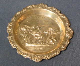 A circular Dutch embossed silver pin tray decorated cherubs 4"
