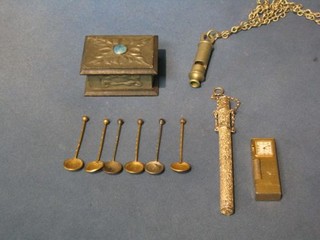 A Metropolitan pattern War Office issue whistle, a pewter mounted stamp box, a metal pencil case, a gold plated lighter and 6 gilt metal salt spoons made from old pennies