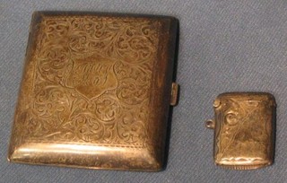 A silver vesta case and an engraved silver cigarette case (2)