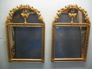 A pair of arched plate mirrors contained in a gilt carved wood frames, decorated grapes 23"