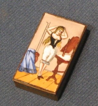 A 19th/20th Century brass vesta case the lid enamelled a standing lady wearing bloomers 1 1/2"