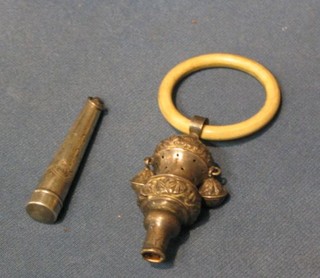 A "silver" rattle with bone teething ring and a cheroot holder contained in an engraved silver case