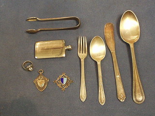 A collection of silver plated flatware