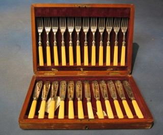 A set of 11 silver plated fish knives and forks with bone handles