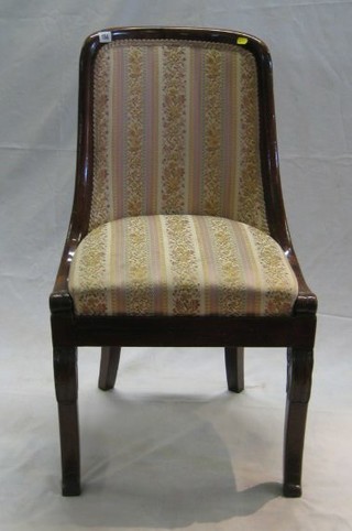 A Regency Empire style tub back chair with upholstered seat, on scrolled supports