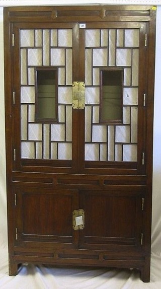 A 19th Century Korean hardwood cabinet enclosed by panelled doors 34"