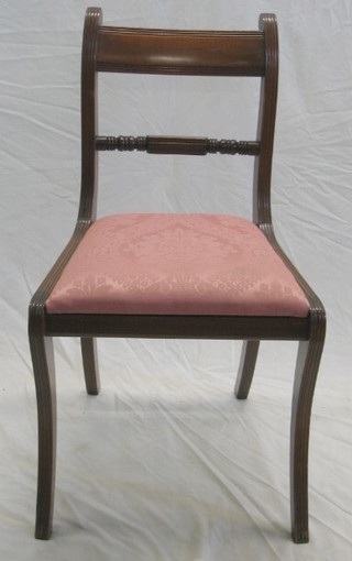 A set of 6 Georgian style mahogany bar back dining chairs with turned mid rails and upholstered drop in seats, raised on sabre supports