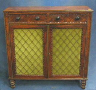 A Regency mahogany chiffonier fitted 2 drawers above a double cupboard enclosed by grilled panelled doors, raised on turned supports 37"