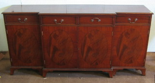 A Georgian style mahogany inverted break front sideboard fitted 4 drawers above 4 cupboards, raised on bracket feet 71"
