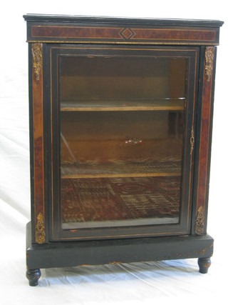 A Victorian ebonised and walnutwood banded pier cabinet with gilt metal mounts, the interior fitted adjustable shelves enclosed by a glazed panelled door, 30"