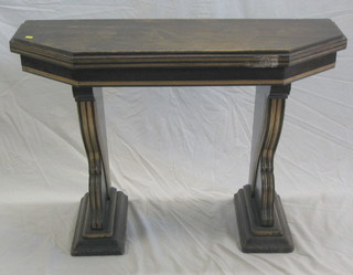 A Victorian mahogany lozenge shaped side table raised on scrolled supports 43"