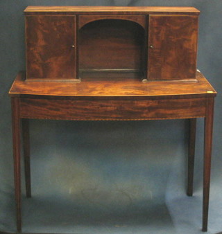 A Georgian inlaid mahogany writing table with raised super structure to the back, the interior fitted pigeon holes and 8 drawers with turned ivory handles, raised on square tapering supports 39"