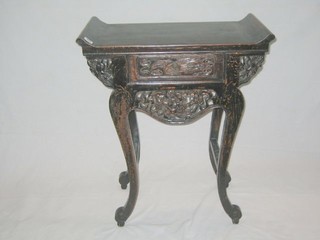 An Oriental hardwood side table fitted a frieze drawer, raised on cabriole supports 27"