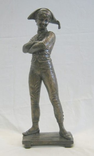 A modern bronze figure of a Harlequin standing on a planked floor 22"